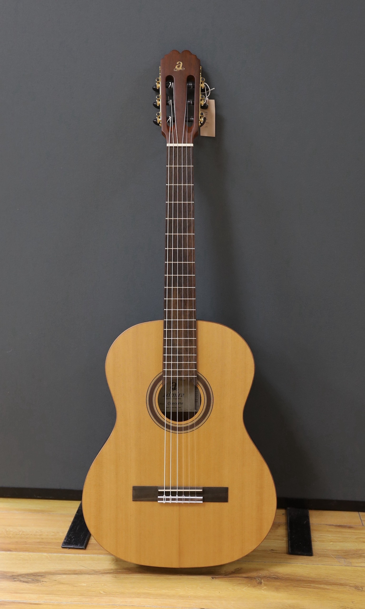 An Admira 'Concerto' classical guitar. Cedar top, satin finish with rosewood back and sides